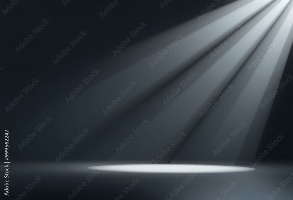 A single spotlight shining down onto a dark surface. A single spotlight shining down onto a dark surface.