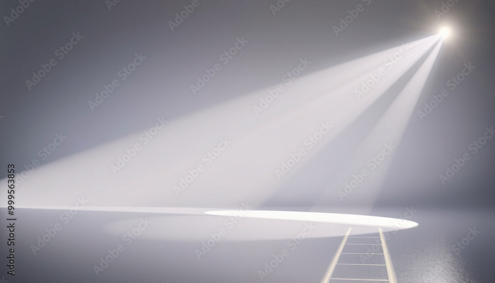 A white spotlight shines on a circular platform with a ladder in a gray room. A white spotlight shines on a circular platform with a ladder in a gray room.