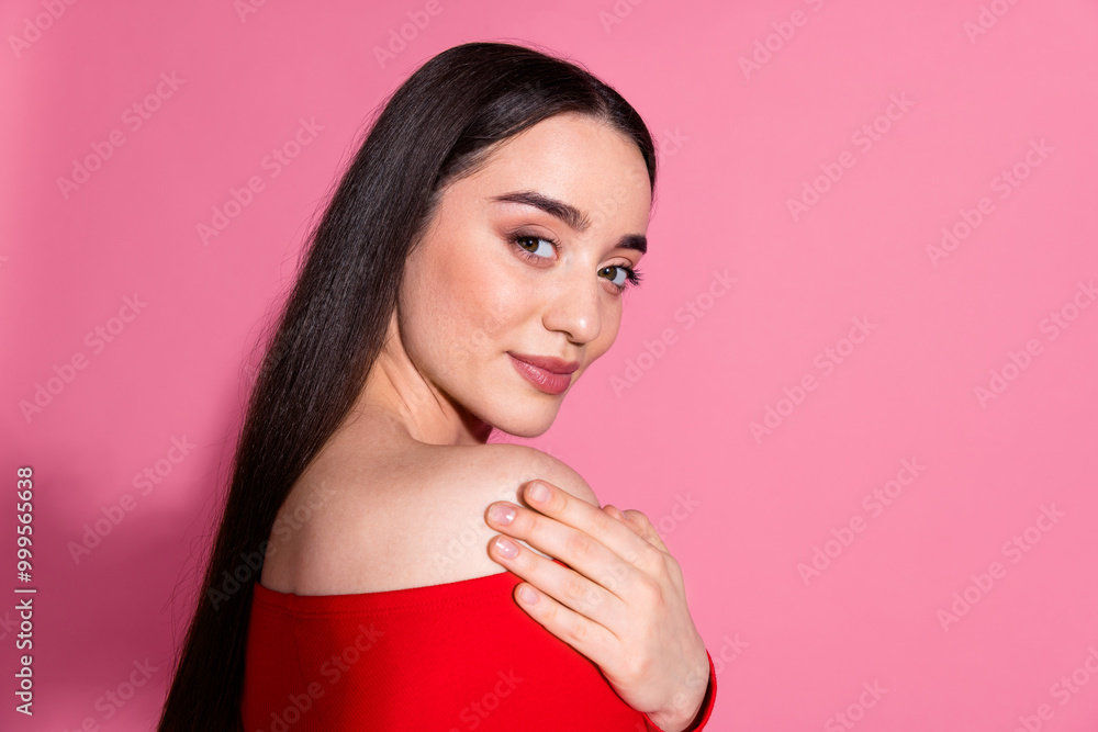 Profile portrait of pretty young girl arm touch shoulder red top isolated on pink color background Profile portrait of pretty young girl arm touch shoulder red top isolated on pink color background