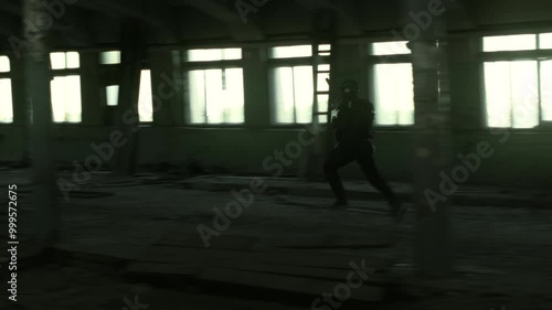 Wallpaper Mural Quick reaction force operator in black military outfit and an m4 assault rifle with a green laser running in an abandoned warehouse Torontodigital.ca