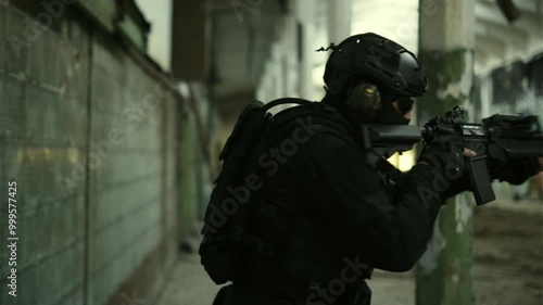 Wallpaper Mural Soldier in black military outfit and an assault rifle with green laser clearing an abandoned warehouse Torontodigital.ca