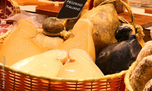 Italian cheeses caciocavallo and also pecorino with the text written on a black background for sale in the Italian stall photo