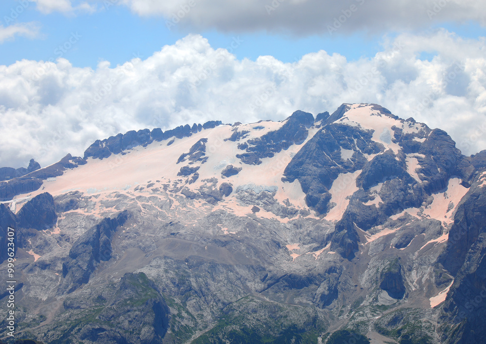 Marmolada glacier at over 3000 meters in Italy covered with pinkish sand brought from the African desert Marmolada glacier at over 3000 meters in Italy covered with pinkish sand brought from the African desert