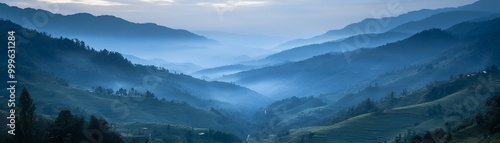 Misty mountain landscape with blue hues.