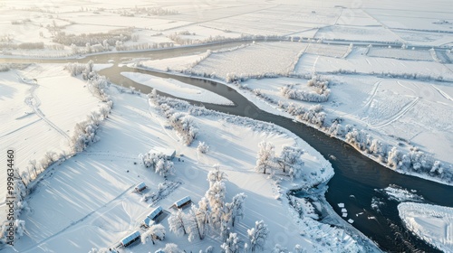 Aerial View of a River Winding Through a Snowy Landscape