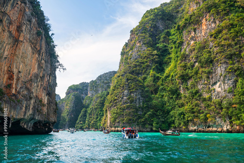 tourist boats sailing to Loh Samah Bay of Pileh at Phi Phi island, Krabi photo