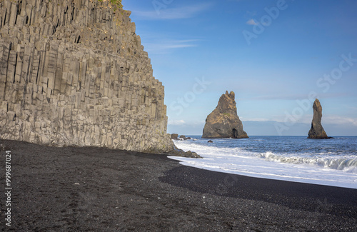 basalt columns and the Reynisdrangar sea stacks from the black sand beach of Reynisfjara, Vík, South Iceland
