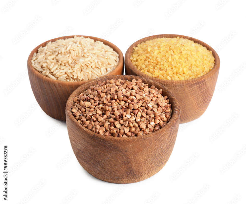 Different cereal grains in wooden bowls isolated on white Different cereal grains in wooden bowls isolated on white