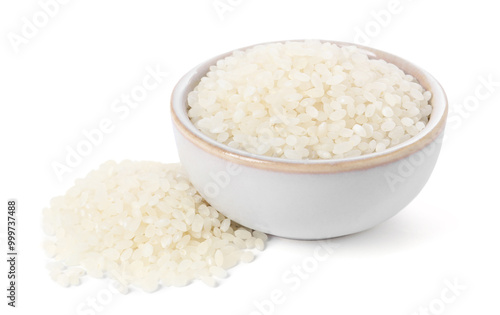 Raw rice in bowl isolated on white