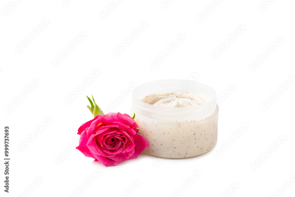 Salt body scrub with rose aroma and flowers isolated on white background. Scrub with pink sea salt. Spa treatments. Natural skin care cosmetics with herbs and essential oils. skincare concept. Salt body scrub with rose aroma and flowers isolated on white background. Scrub with pink sea salt. Spa treatments. Natural skin care cosmetics with herbs and essential oils. skincare concept.
