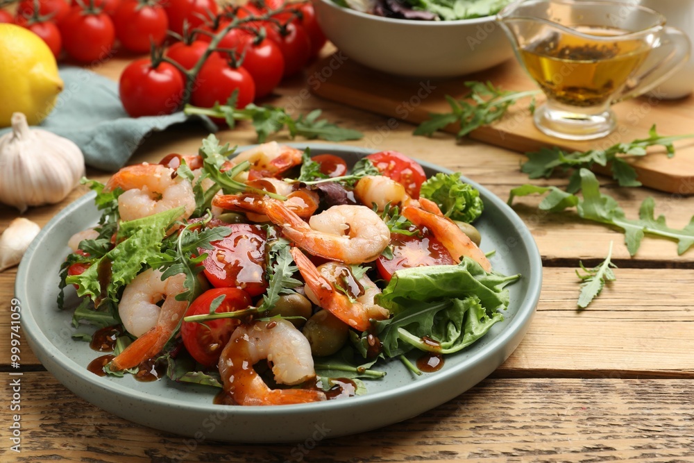 Delicious shrimp salad with vegetables on wooden table Delicious shrimp salad with vegetables on wooden table