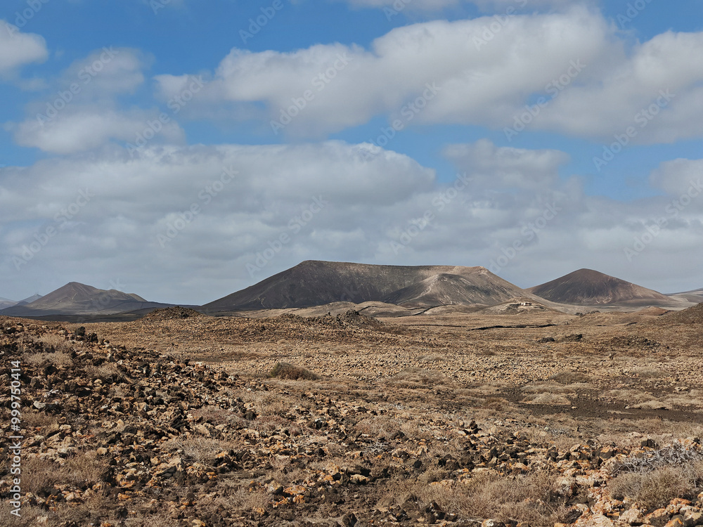 Arid landscape of Costa Teguise with mountains and volcanoes Lanzarote Spain Arid landscape of Costa Teguise with mountains and volcanoes Lanzarote Spain
