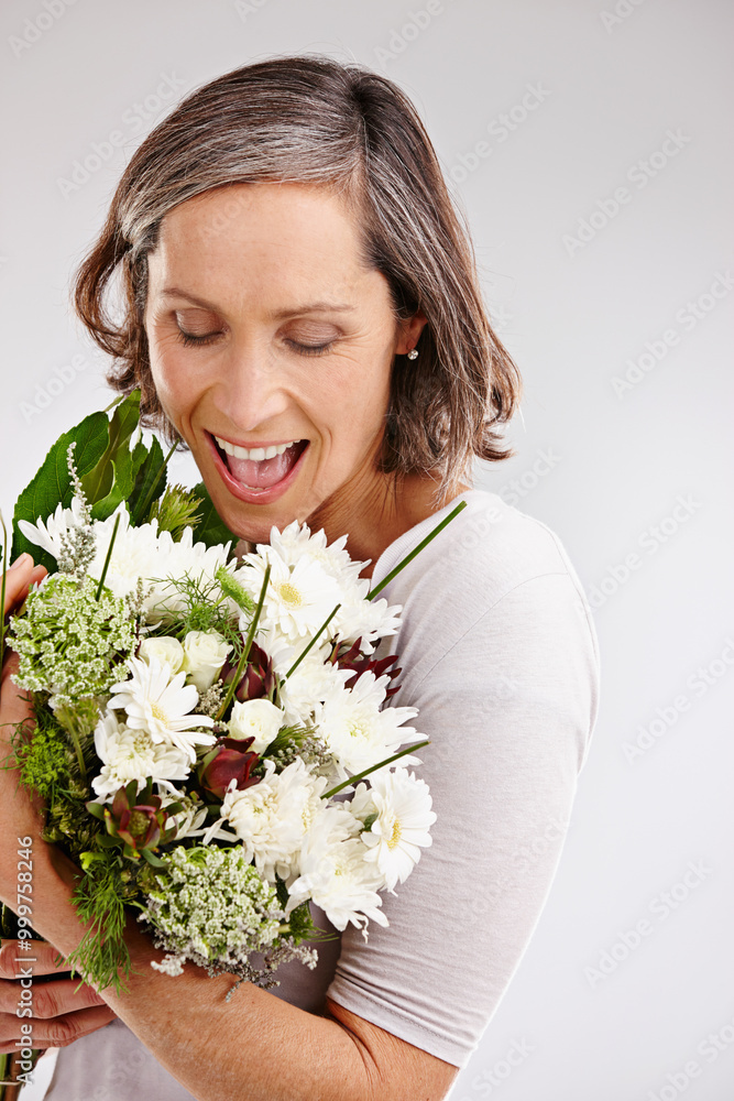 Mature woman, studio and excited with flowers with confidence for gift or present on white background. Female person, smile and joy or satisfied with roses for appreciation, love and positivity Mature woman, studio and excited with flowers with confidence for gift or present on white background. Female person, smile and joy or satisfied with roses for appreciation, love and positivity
