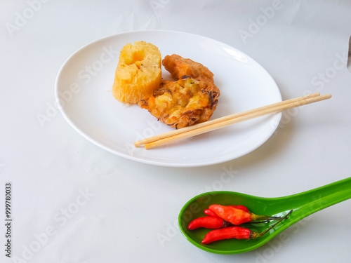 Gorengan : Fried food is one of the most popular types of snacks in Indonesia. Indonesian street food.Black background. photo