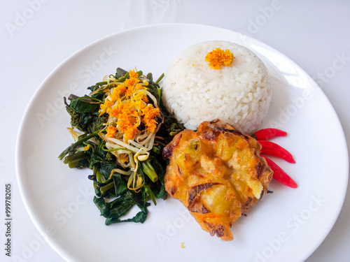 Urap Sayur. healthy and traditional indonesian food isolated on white photo