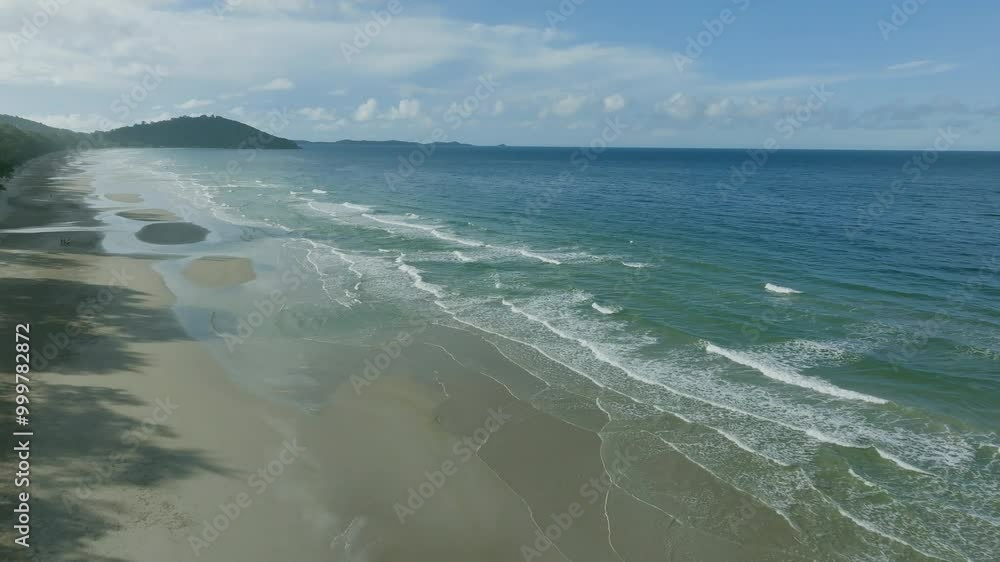Coastal Waves Gently Lapping the Shore on a Sunny Day at a Serene Beach Location Coastal Waves Gently Lapping the Shore on a Sunny Day at a Serene Beach Location