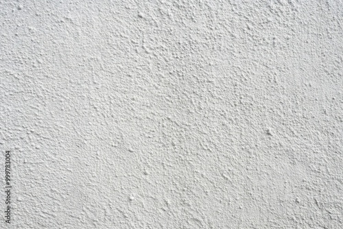 Grey cement texture on a white concrete wall background, high angle view