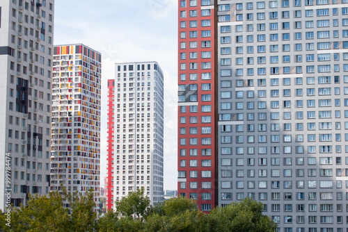 A modern residential quarter with fashionable bright houses. Real estate, new buildings photo