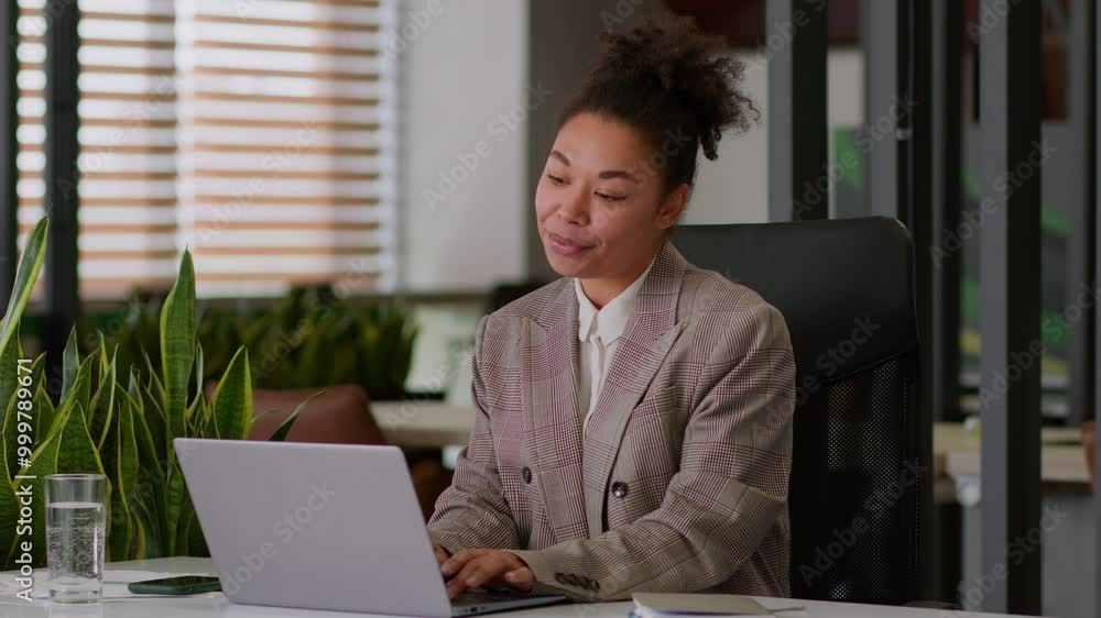 Female pc user African American ethnic woman lady business employer smiling positive businesswoman worker manager agent online working laptop computer happy girl sing listen music in office good mood Female pc user African American ethnic woman lady business employer smiling positive businesswoman worker manager agent online working laptop computer happy girl sing listen music in office good mood