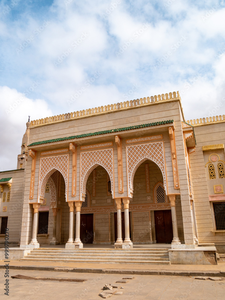 Obraz premium Side entrance of Saudi Mosque, Nouakchott, Mauritania on a clear morning - Portrait Shot