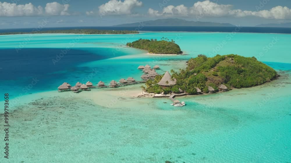 Aerial view of luxury resort in tropic Bora Bora, French Polynesia, overwater bungalows remote hotel accommodation on coral reef turquoise lagoon. Wild nature paradise, exotic summer travel background Aerial view of luxury resort in tropic Bora Bora, French Polynesia, overwater bungalows remote hotel accommodation on coral reef turquoise lagoon. Wild nature paradise, exotic summer travel background