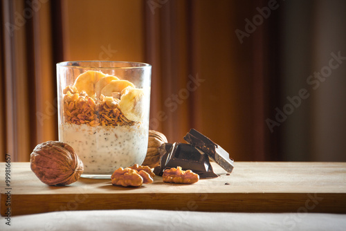 Healthy Breakfast Parfait with Banana, Granola, Walnuts, and Dark Chocolate