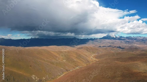 Aerial Photography of Snow Mountain Scenery on the Pagoda Grassland in Xinduqiao, Garze Prefecture, Sichuan Province, China photo