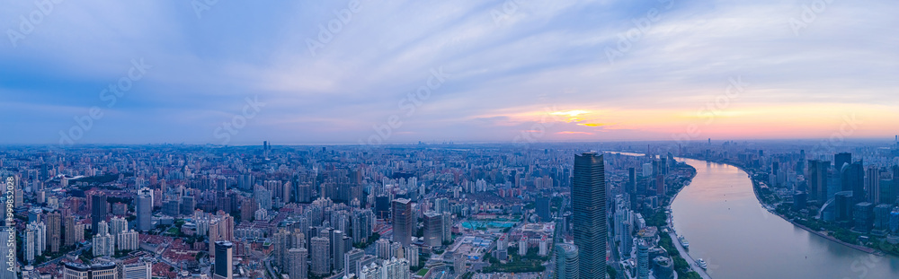 Aerial view of modern city skyline and buildings at sunrise in Shanghai Aerial view of modern city skyline and buildings at sunrise in Shanghai