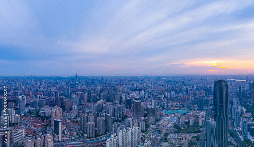 Aerial view of modern city skyline and buildings at sunrise in Shanghai Aerial view of modern city skyline and buildings at sunrise in Shanghai