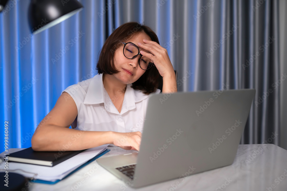 Beautiful asian woman working at home on the night,A lot of work from company,bring home work,Work from home Beautiful asian woman working at home on the night,A lot of work from company,bring home work,Work from home