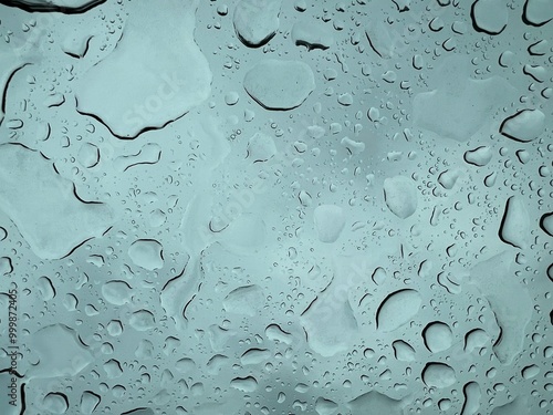 Water drop in a blue glass in autumn
