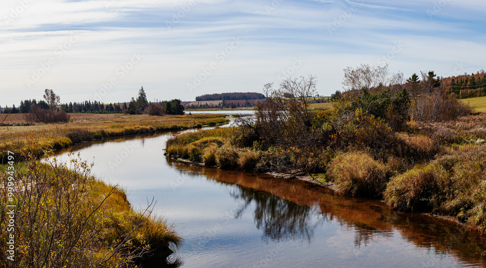 Meandering stream in rural landscape along the Island Trail, Prince Edward Island, Canada Meandering stream in rural landscape along the Island Trail, Prince Edward Island, Canada