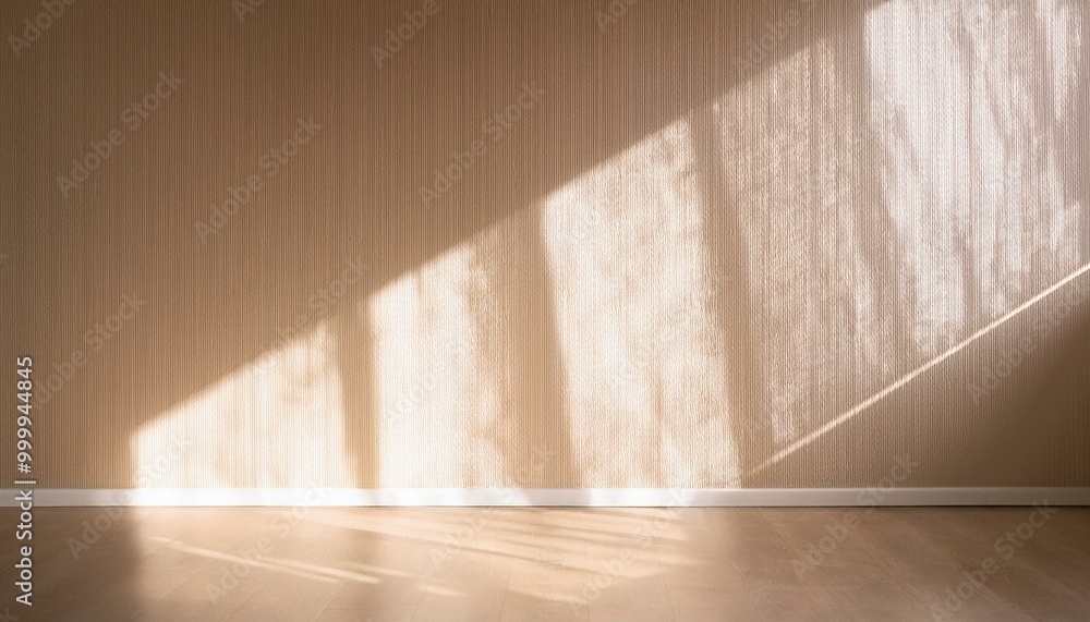 Light on the background wall. Shadow from the window and sunlight. White rays of the sun in a bright empty room. Shade overlay. Modern studio in beige tones. interior of a room with a window Light on the background wall. Shadow from the window and sunlight. White rays of the sun in a bright empty room. Shade overlay. Modern studio in beige tones. interior of a room with a window