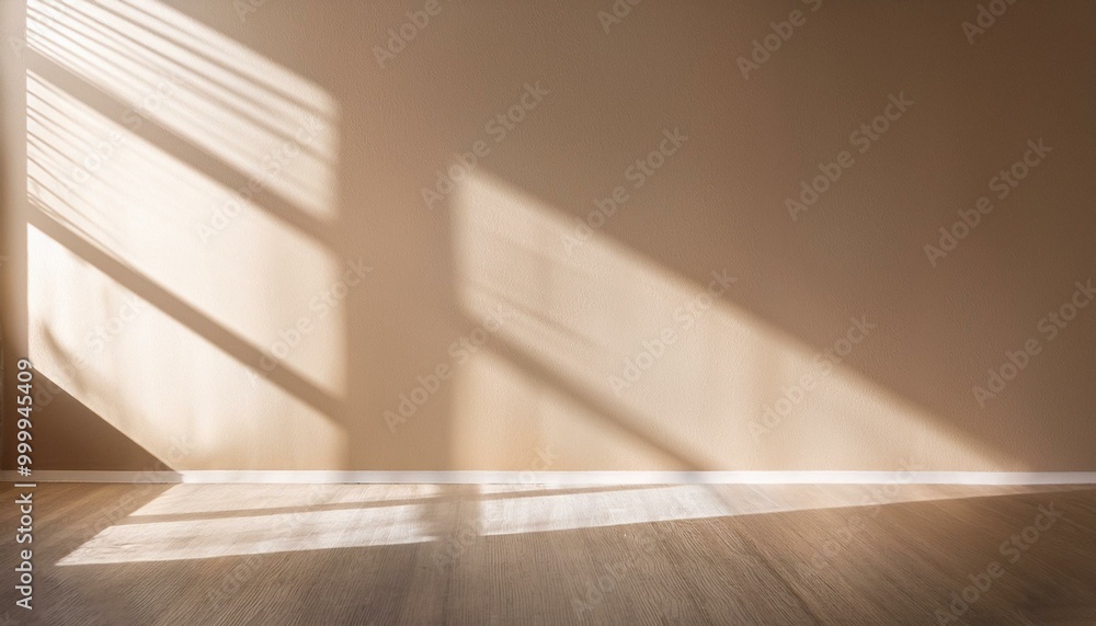 Light on the background wall. Shadow from the window and sunlight. White rays of the sun in a bright empty room. Shade overlay. Modern studio in beige tones. interior of a room with a window Light on the background wall. Shadow from the window and sunlight. White rays of the sun in a bright empty room. Shade overlay. Modern studio in beige tones. interior of a room with a window