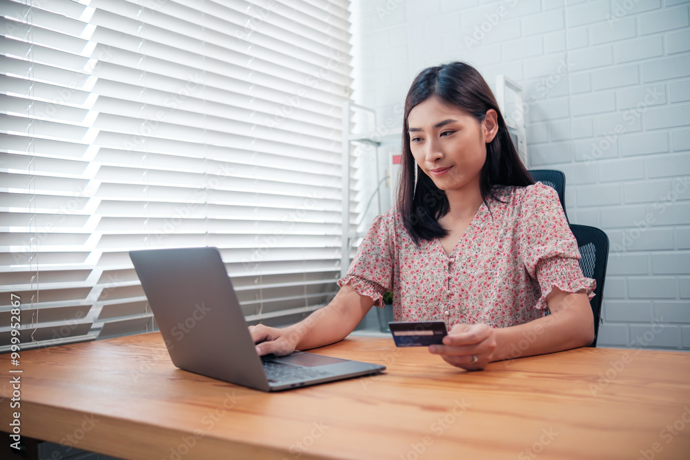 Asian woman shopping online store e-commerce concept, shopping online market purchasing digital payment through computer laptop device, ordering purchasing item product with packaging parcel box. Asian woman shopping online store e-commerce concept, shopping online market purchasing digital payment through computer laptop device, ordering purchasing item product with packaging parcel box.