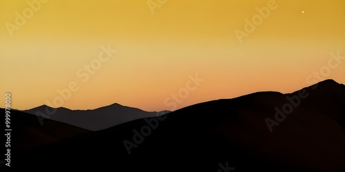 Wallpaper Mural Silhouetted mountains against an orange and yellow sunset sky with a crescent moon Torontodigital.ca