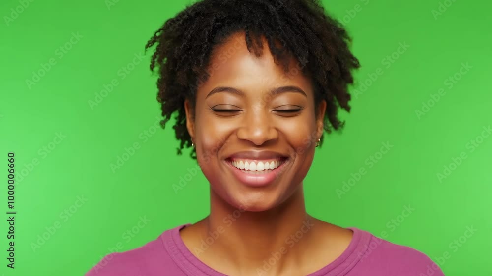 Woman smiling with closed eyes on green background Woman smiling with closed eyes on green background