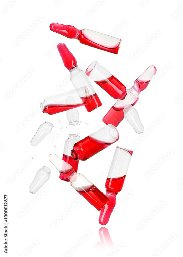 Obraz premium Many ampoules and glass pieces falling on white background