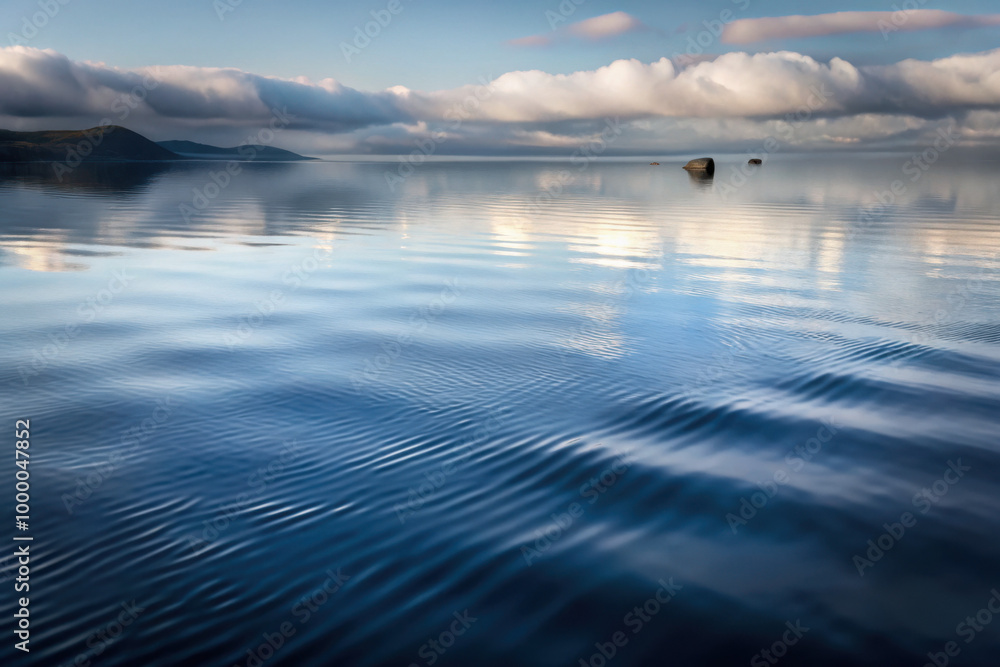 Obraz premium Gentle ripples dance across the tranquil surface of a serene lake under a bright sky, capturing the essence of calmness at dawn. Generative AI