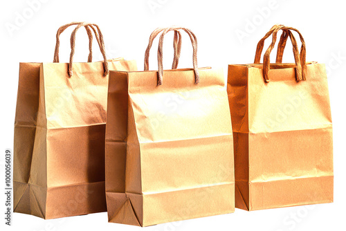 Three brown paper shopping bags with twisted handles isolated on white photo