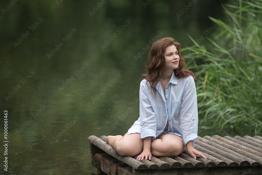 Beautiful young dark-haired girl by the river. Beautiful young dark-haired girl by the river.