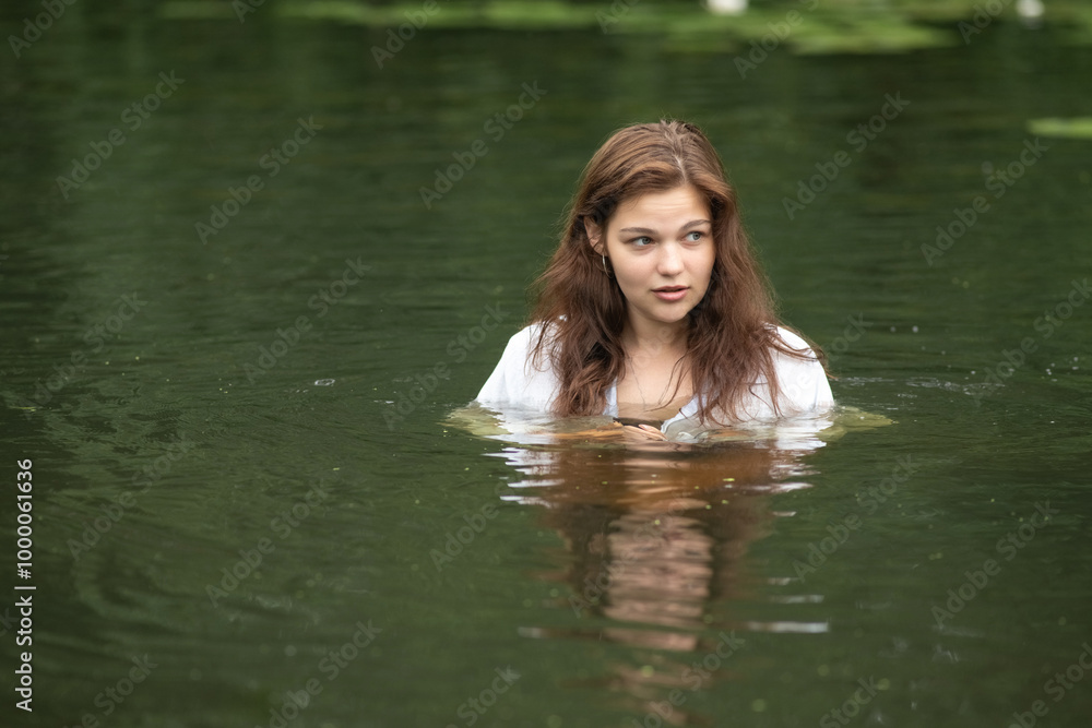 Beautiful young dark-haired girl by the river. Beautiful young dark-haired girl by the river.