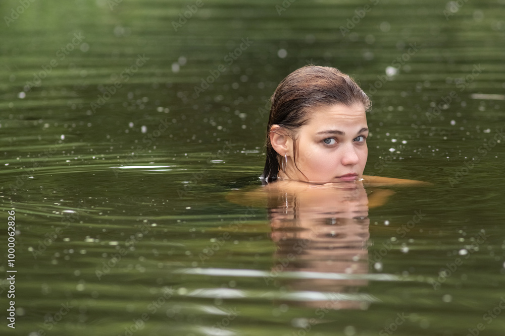 Beautiful young dark-haired girl by the river. Beautiful young dark-haired girl by the river.