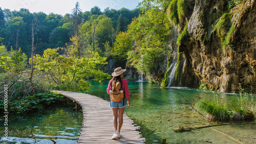 Valokuva A tranquil stroll along the wooden paths of Plitvice Lakes in Croatia, surrounde