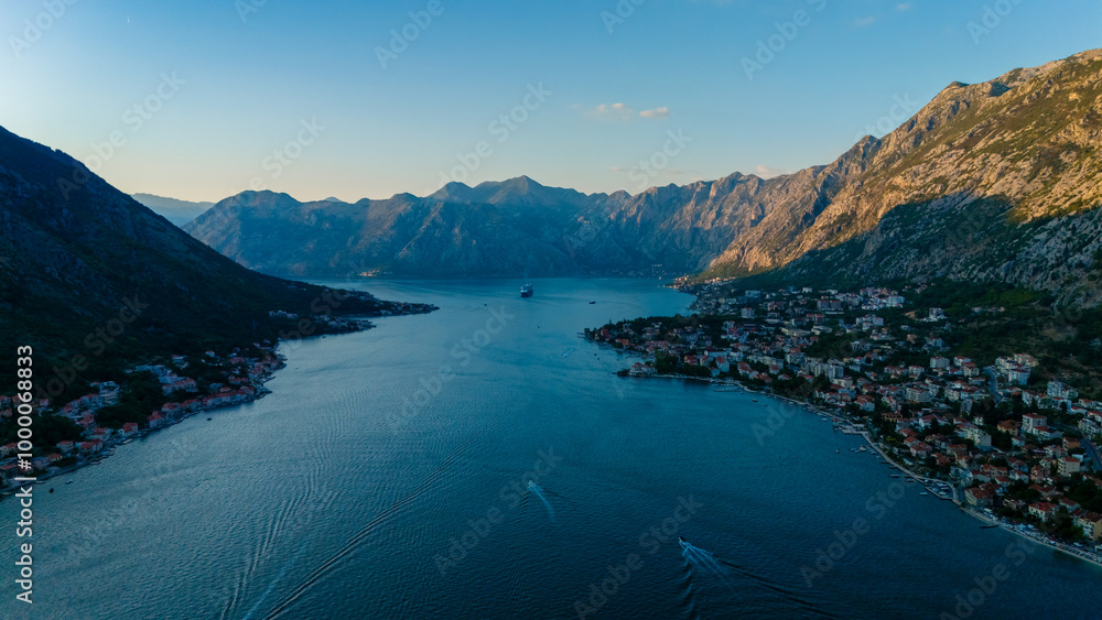 Obraz premium Stunning aerial view of Kotor Bay in Montenegro at sunset, showcasing mountains and coastal beauty