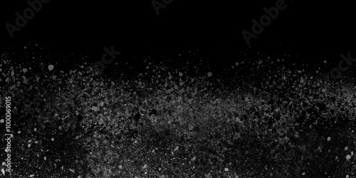 Abstract grey splatter on black background. grey powder explosion background with Freeze motion of black powder .Abstract design of dust crystal. Particles explosion screen saver, wallpaper ...	
