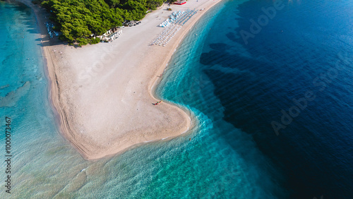 Fototapeta Naklejka Na Ścianę i Meble -  Stunning aerial view of Brac Island's golden beach and turquoise waters on a sunny day