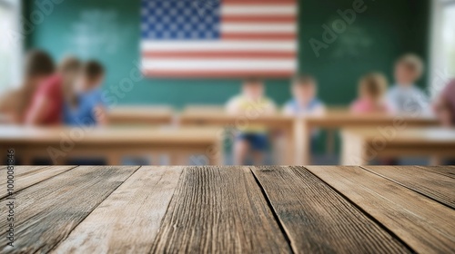 Wooden tabletop in a classroom with chalkboard and American flag in the backg...