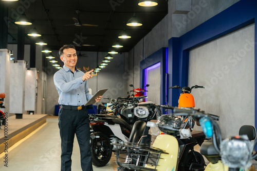 asian businessman working using digital tablet in electric bicycle photo