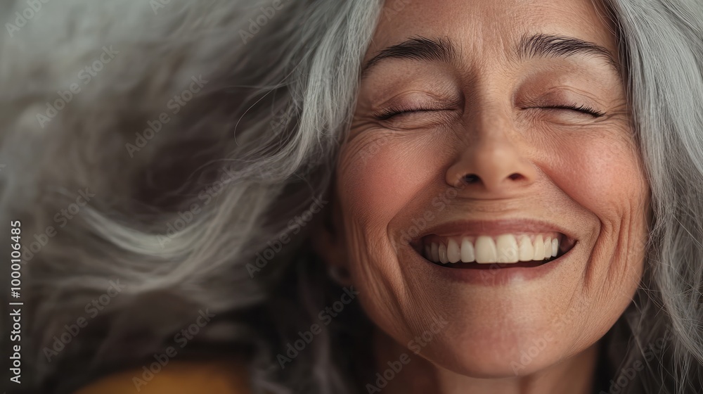 Beautiful gorgeous 50s mid age beautiful elderly senior model woman with grey hair laughing and smiling. Mature old lady close up portrait. Healthy face skin care beauty, skincare cosmetics, dental. Beautiful gorgeous 50s mid age beautiful elderly senior model woman with grey hair laughing and smiling. Mature old lady close up portrait. Healthy face skin care beauty, skincare cosmetics, dental.